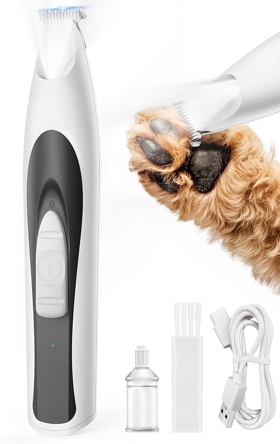 White and black oneisall paw trimmer beside a retailer illustration of a dog paw, with a USB cord, cleaning brush and oil bottle
